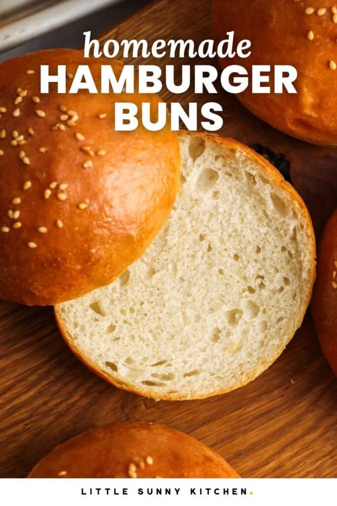 a sliced hamburger bun on a wooden cutting board. Text overlay at top of photo says "homemade hamburger buns"