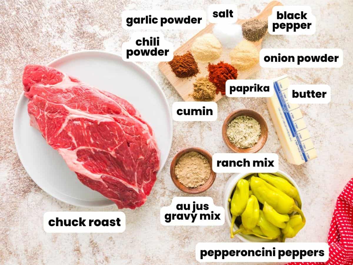 a raw chuck roast along with pepperoncini peppers, butter, and spices to make smoked mississippi pot roast.