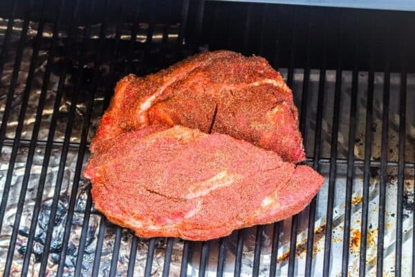 seasoned mississippi pot roast on a smoker grate.