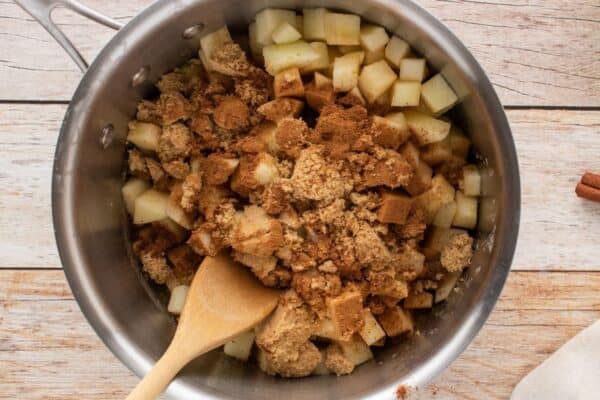 diced apples,cinnamon, nutmeg, and brown sugar in a saucepan.