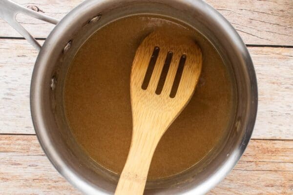 butter and brown sugar melted in a small saucepan, stirred with a slotted wooden spoon.