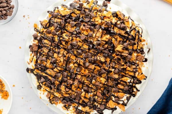 Final topping of chopped Butterfingers, chocolate chips, and chocolate syrup added.