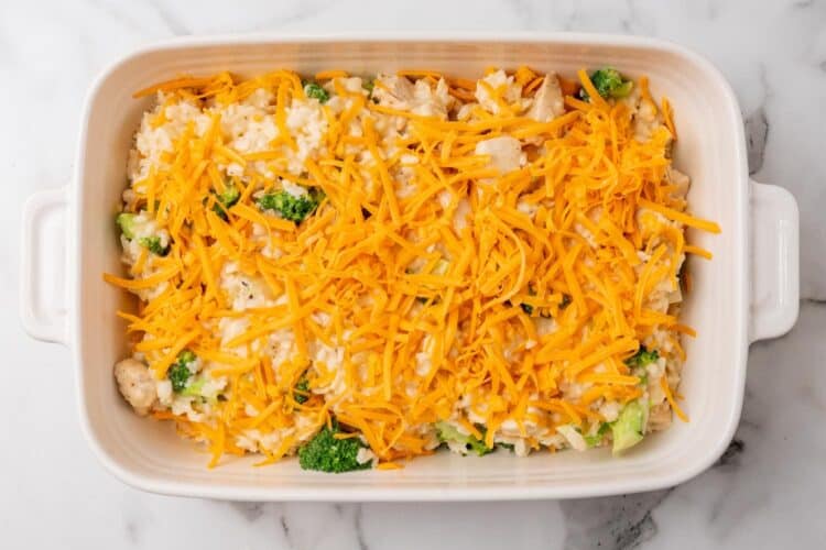 Chicken broccoli rice casserole, topped with shredded cheese.