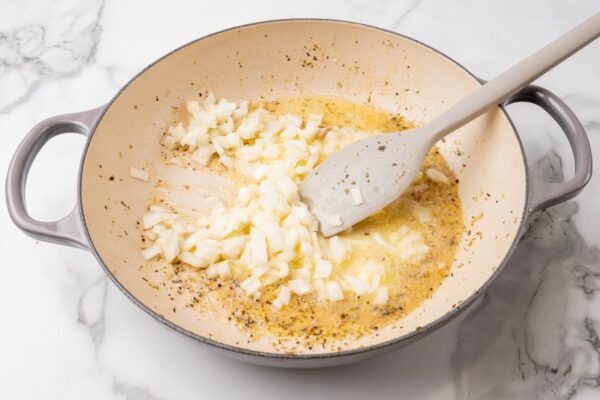 diced onion cooking in oil in a large skillet.