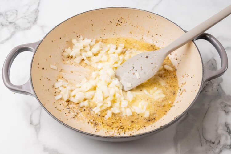diced onion cooking in oil in a large skillet.