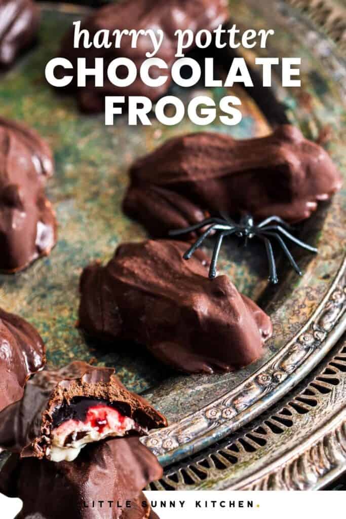 Close-up of homemade chocolate frog candies on an antique silver tray, with a small plastic spider decoration for a spooky Halloween touch.