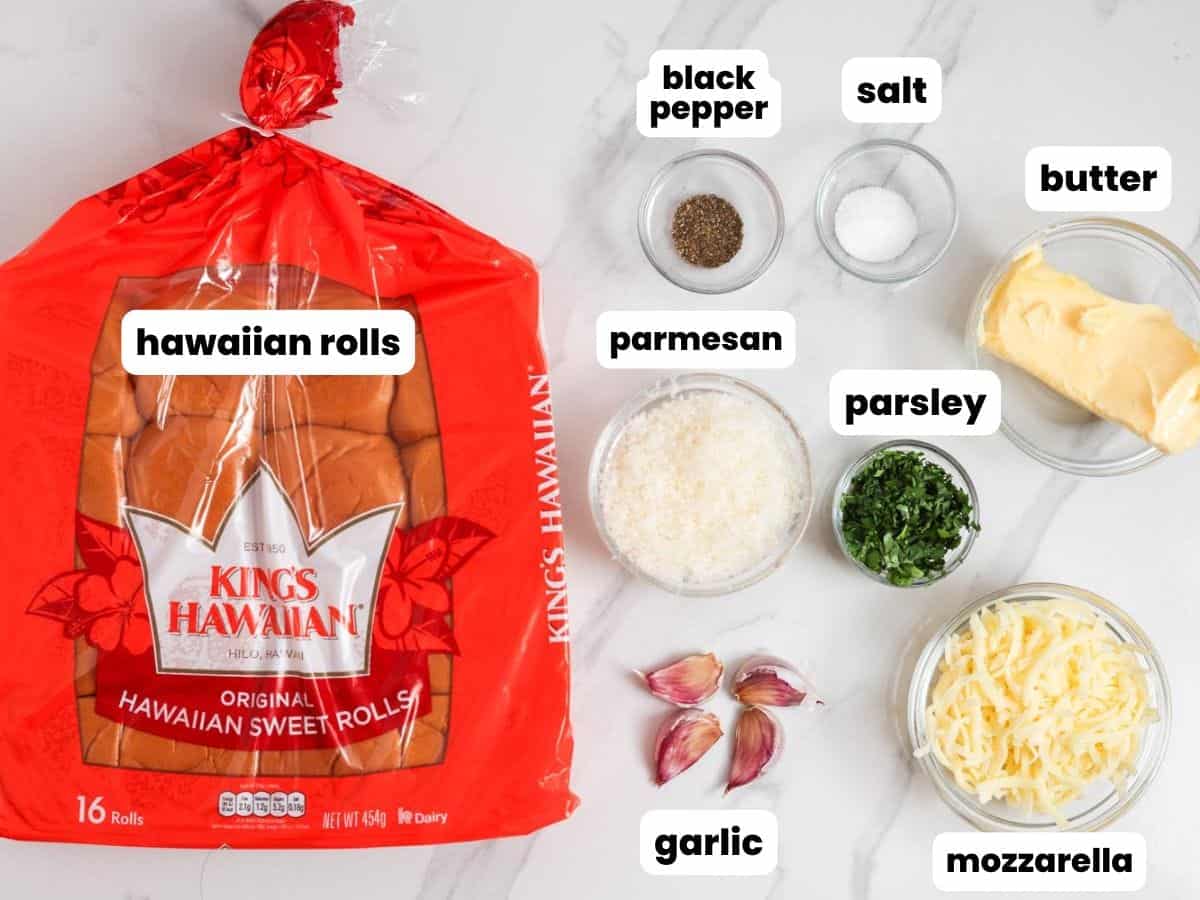 a package of hawaiian rolls along with cheese butter and seasonings to turn them into garlic bread.
