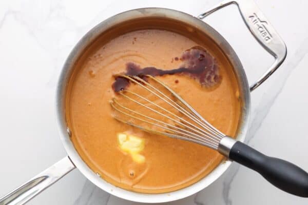 butter and vanilla added to pumpkin pudding that is in a saucepan, removed from the heat.