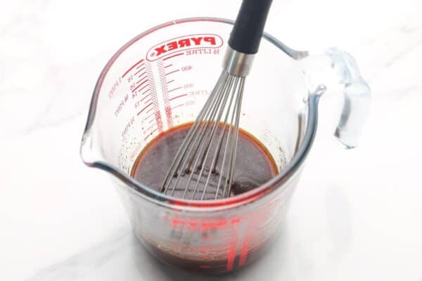 sauce for lettuce wraps mixed in a pyrex measuring cup