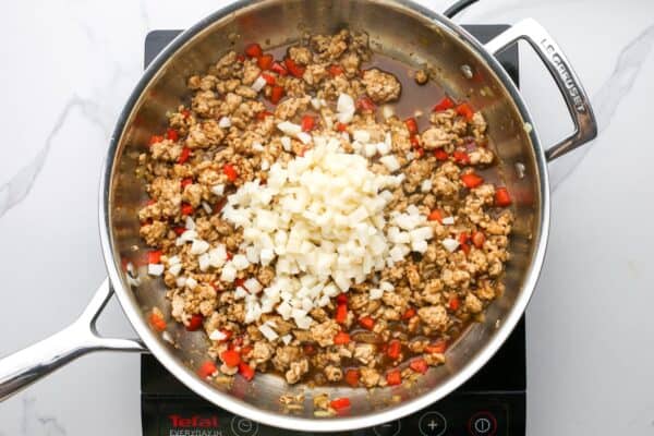 diced water chestnuts added to the cooked ground chicken mixture for asian lettuce wraps.