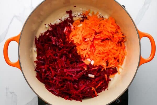 beets and carrots in a dutch oven.