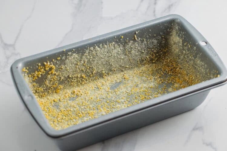 a metal loaf pan greased and coated with cornmeal.