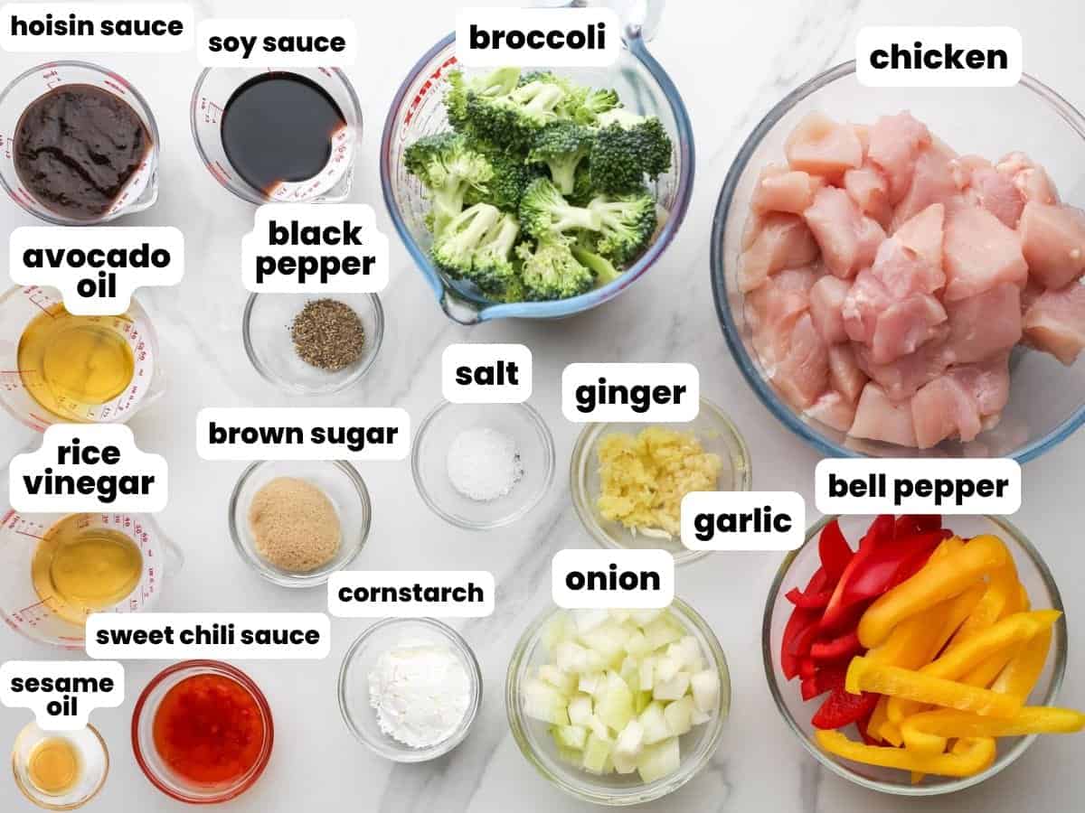 Ingredients for Hoisin chicken with diced chicken breast, sliced peppers, broccoli florets, hoisin sauce, and other flavor ingredients for making the best stir fry sauce.