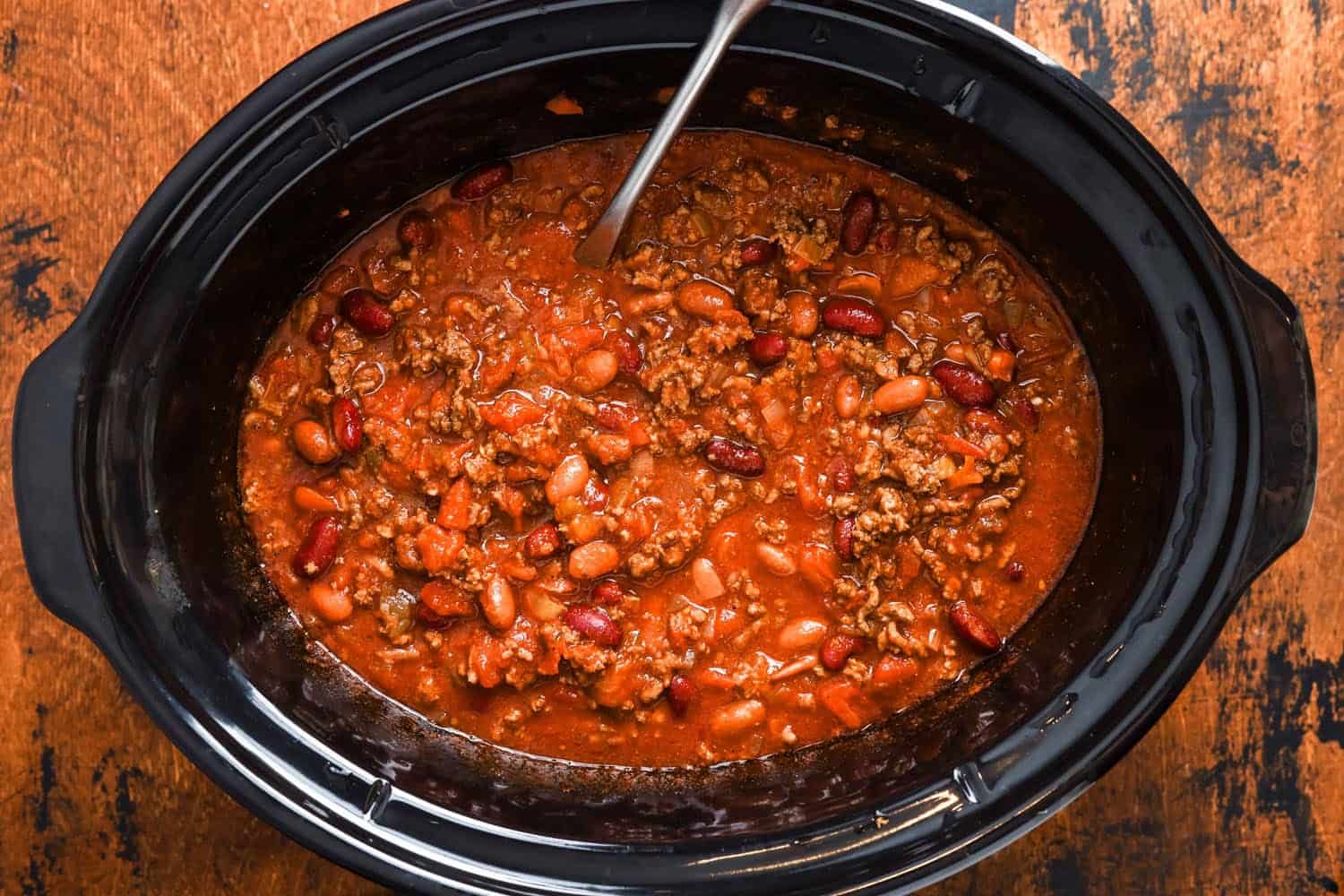 slow cooker beef chili inside the crockpot.