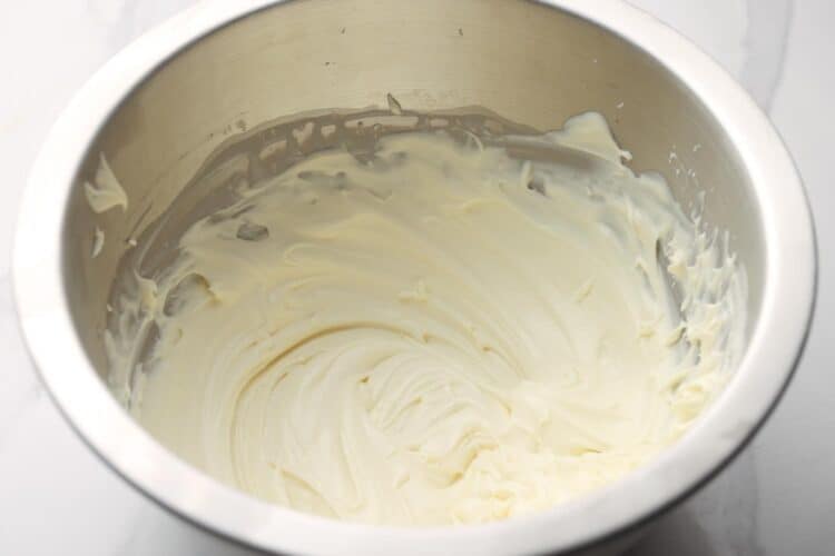 whipped cream to soft peaks in a metal mixing bowl.