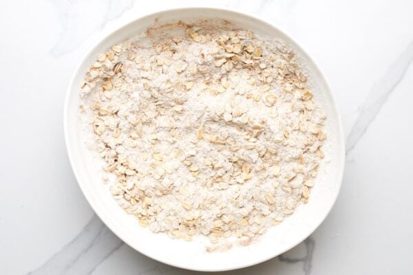 oats, flour, brown sugar mixed together in a shallow bowl.