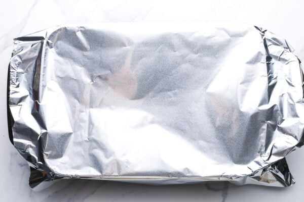 a 9x13 inch baking dish covered loosely with foil.