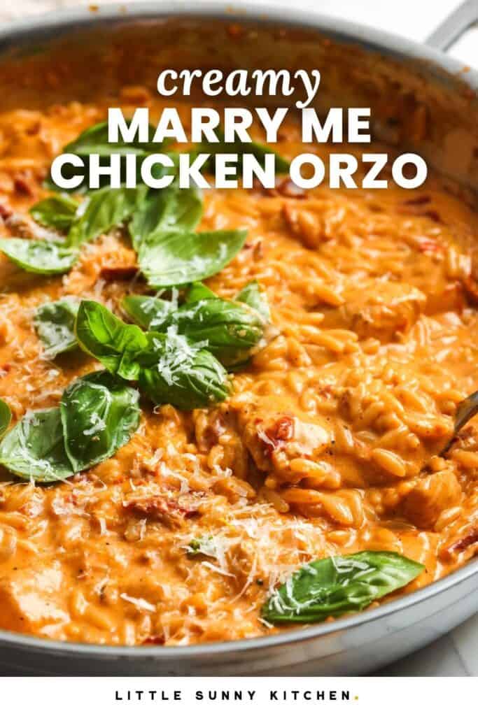 creamy tomato orzo in a skillet, garnished with fresh basil. Text overlay says "creamy marry me chicken orzo.