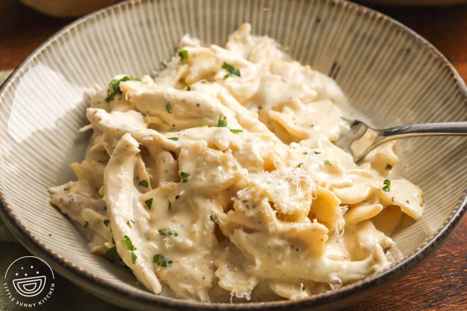 a bowl of slow cooker chicken alfredo.