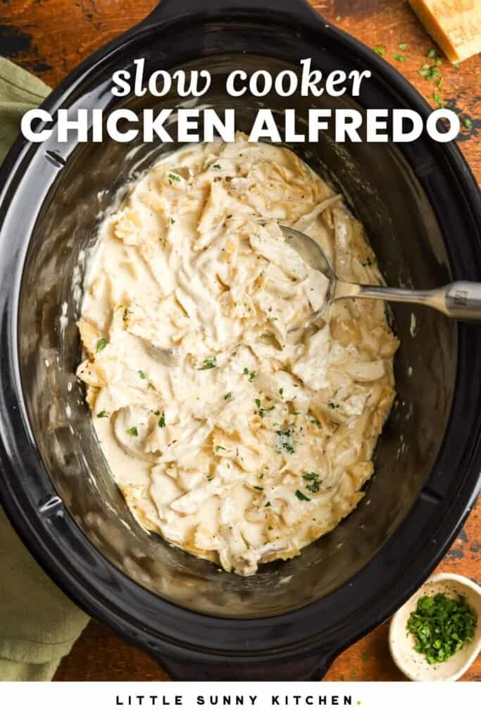 creamy pasta in a slow cooker. Text overlay says "slow cooker chicken alfredo.