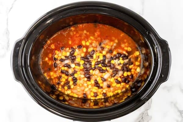 beans and corn in a slow cooker after cooking.