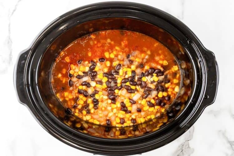 beans and corn in a slow cooker after cooking.