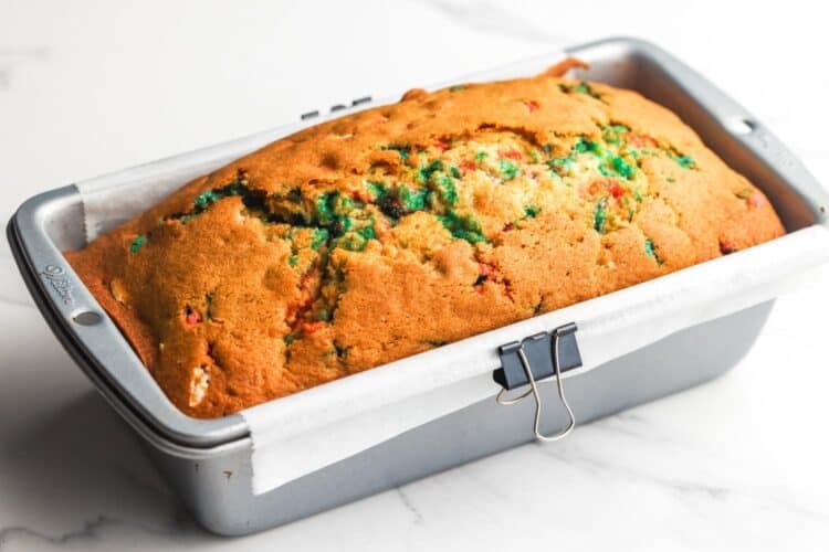 baked christmas bread in a pan lined with parchment paper