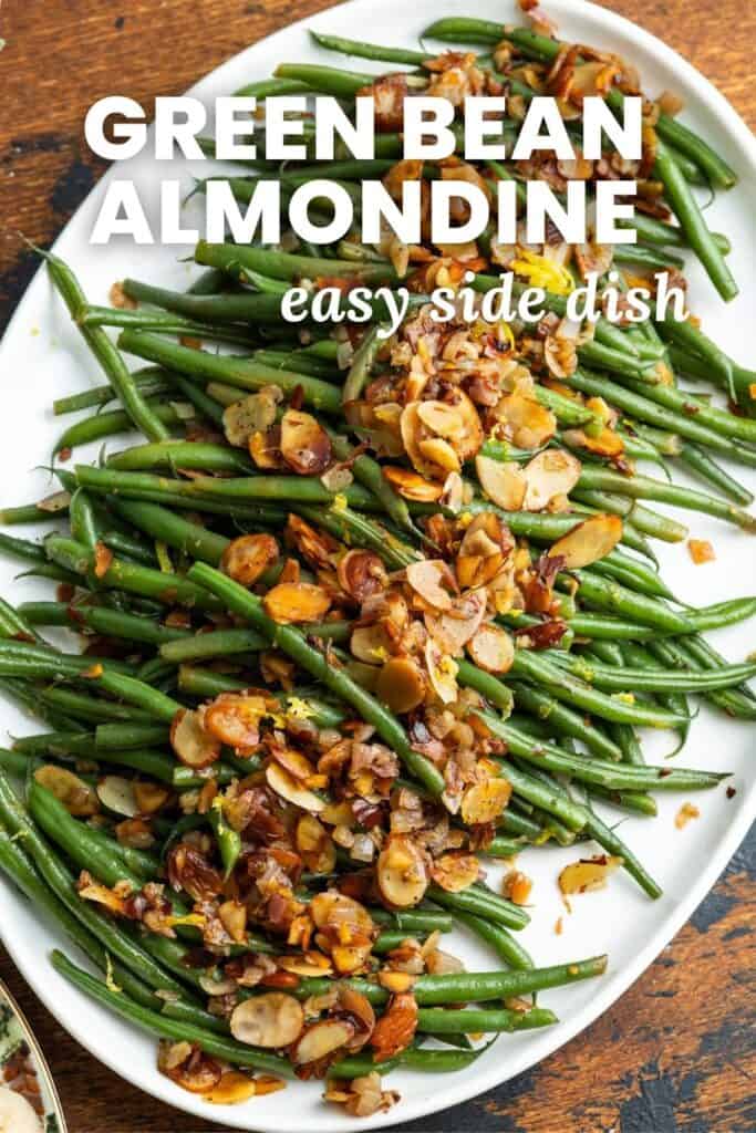 a platter of green beans topped with toasted slivered almonds. Text overlay says "green bean almondine, easy side dish"
