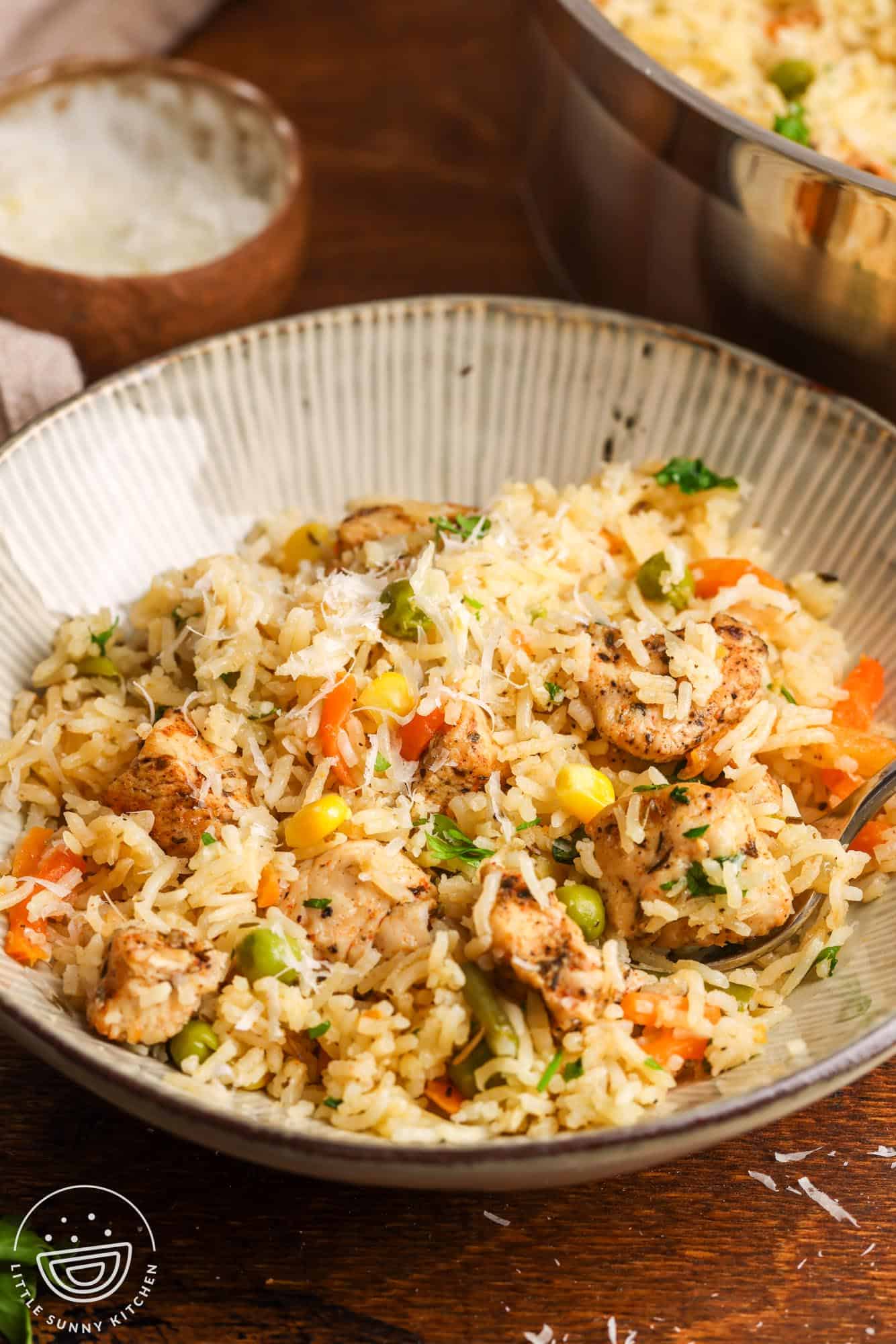 a bowl of one pot chicken and rice.
