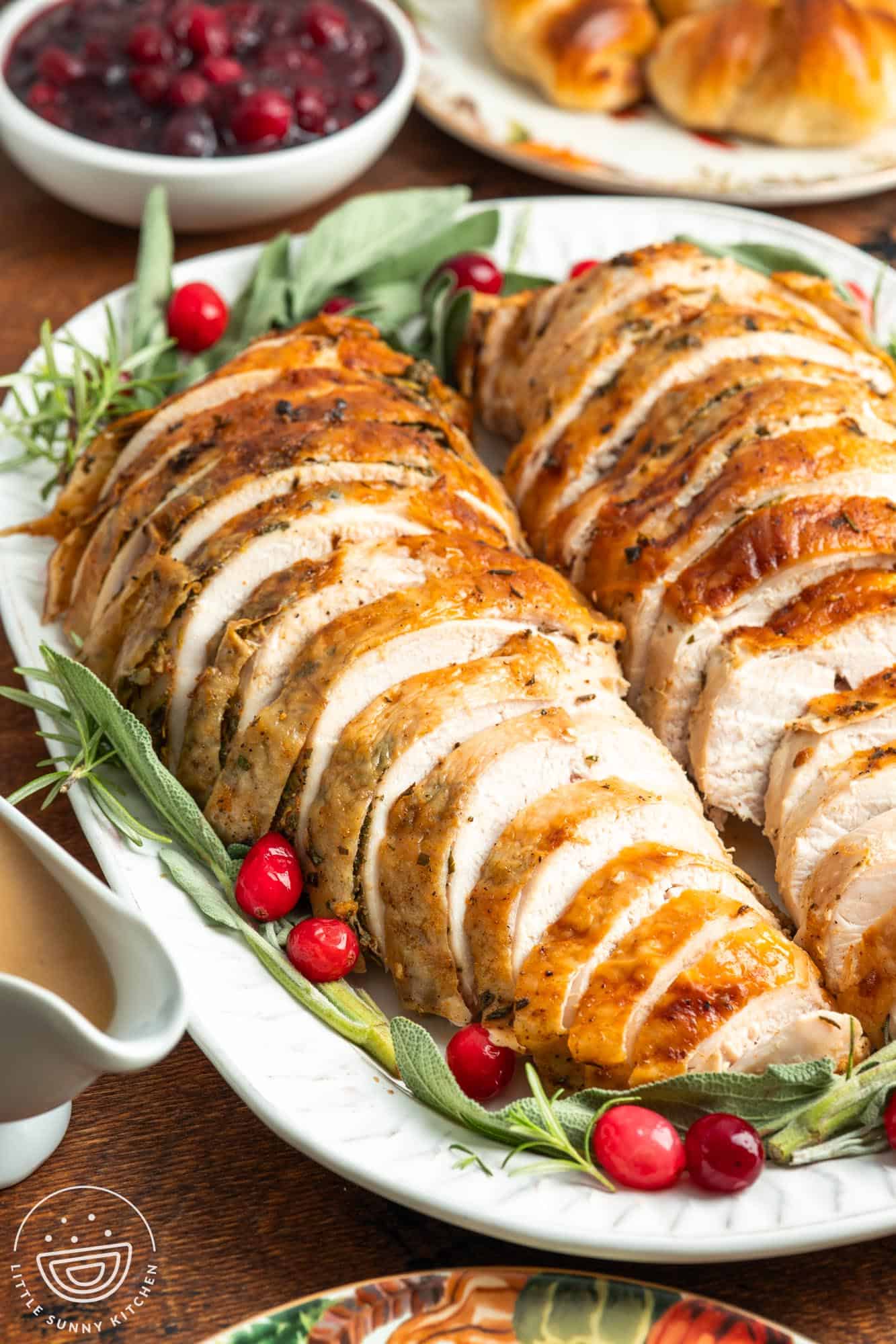 closeup of sliced slow cooker turkey breast on a platter.