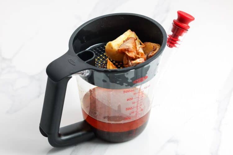 turkey drippings in a special measuring cup that strains the solids and separates the fat.