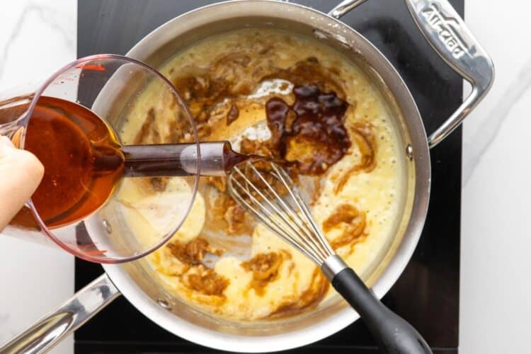turkey drippings added to a roux of flour and butter in a stainless steel saucepan.