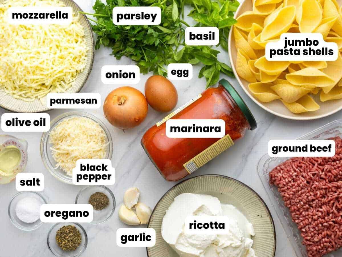 The ingredients for homemade beef stuffed shells with ricotta, ground beef, and cheese. 