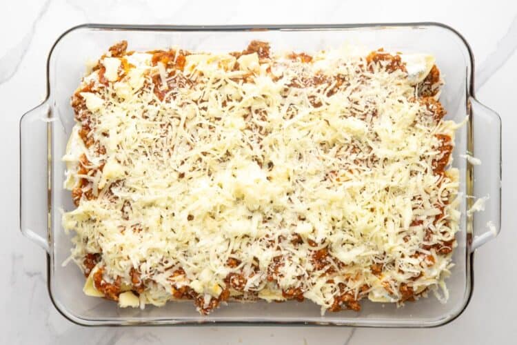 shredded mozzarella cheese added to the top of a beef stuffed shells casserole.