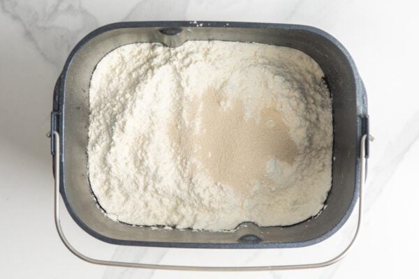 Dry ingredients layered in a bread machine basket