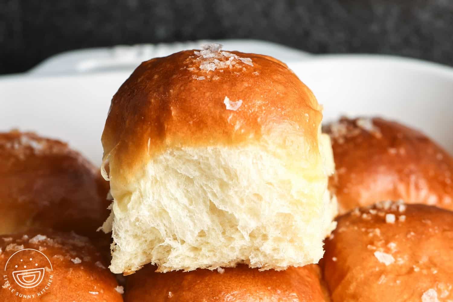Close up shot of a soft dinner rolls showing its texture