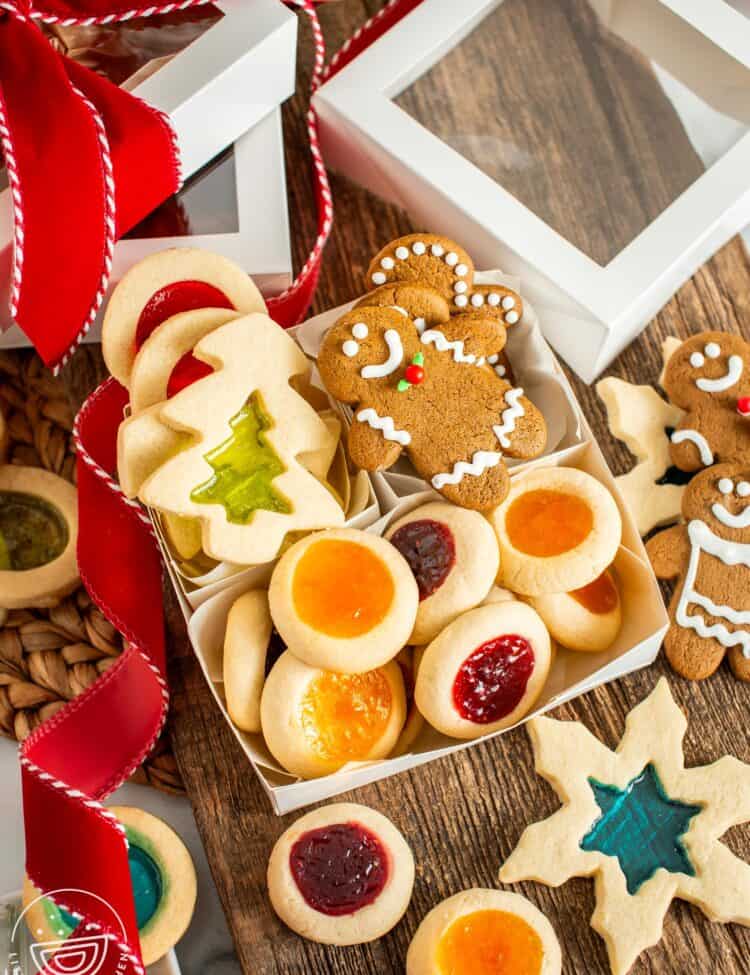 gift box with windowpane cookies, gingerbread men, and thumbprint cookies