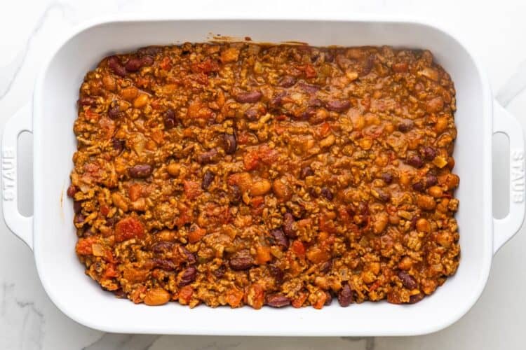beef and beans layer for frito pie, in a 9x13 -inch baking dish.