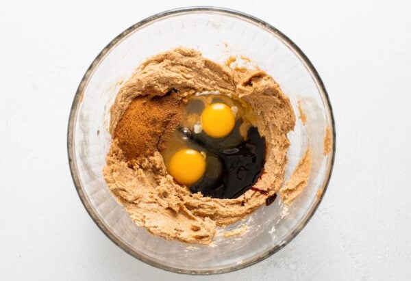 cinnamon, molasses, and eggs added to creamed butter and brown sugar in a large mixing bowl.