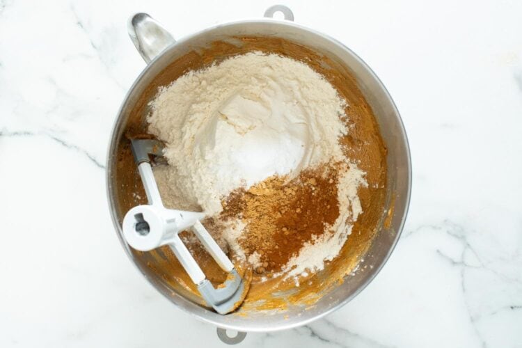 dry ingredients added to wet ingredients to make gingerbread cookie dough.