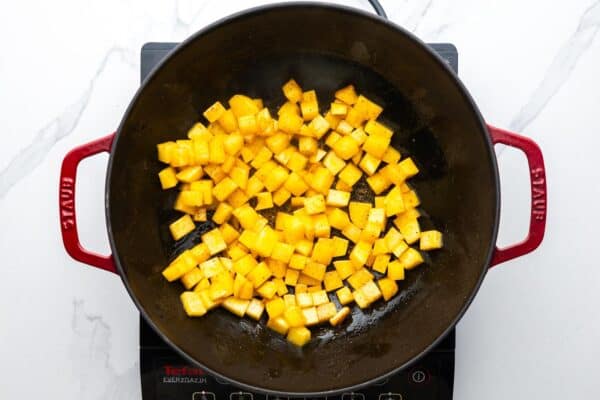 cooked diced potatoes in a skillet.