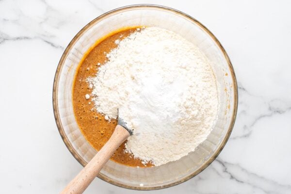 dry ingredients added to wet ingredients to make the batter for sticky toffee pudding cakes.