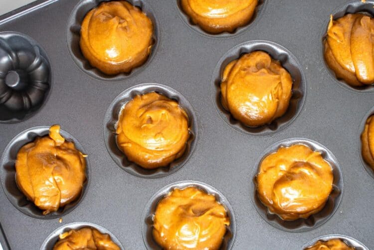 batter for sticky toffee pudding added to mini bundt cake molds.