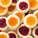 two layers of mixed raspberry and apricot jam thumbprints.