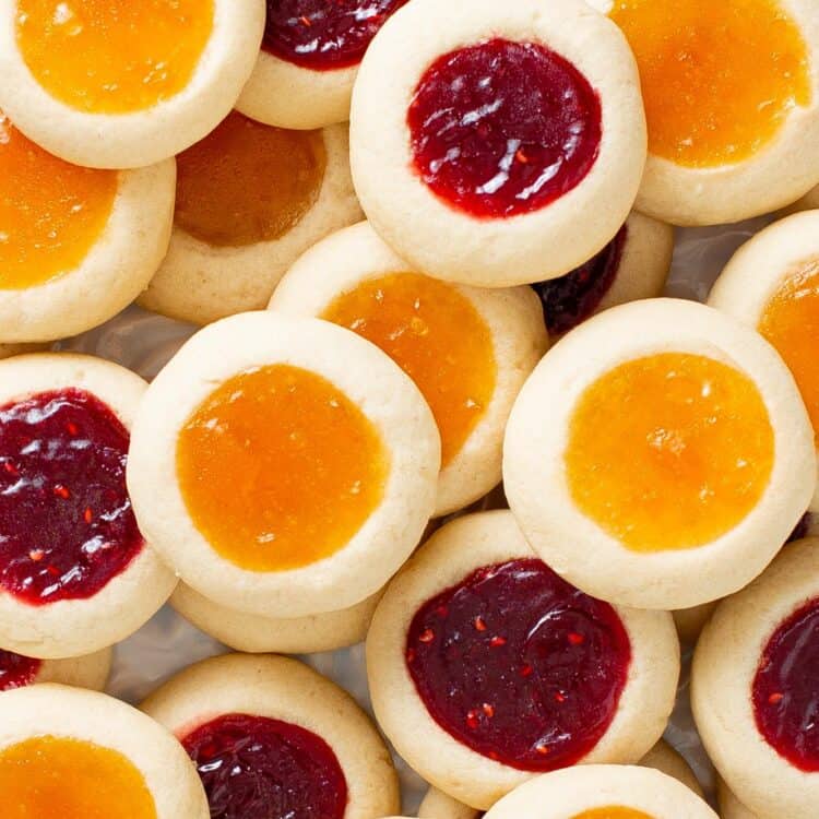 two layers of mixed raspberry and apricot jam thumbprints.