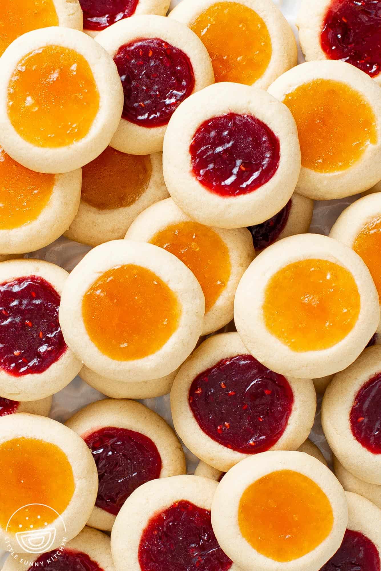 two layers of mixed raspberry and apricot jam thumbprints.