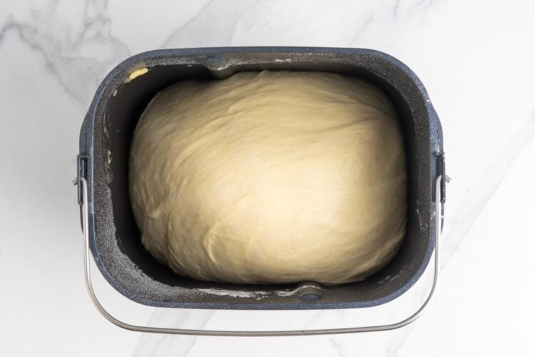 dough for cinnamon rolls in a bread machine pan.