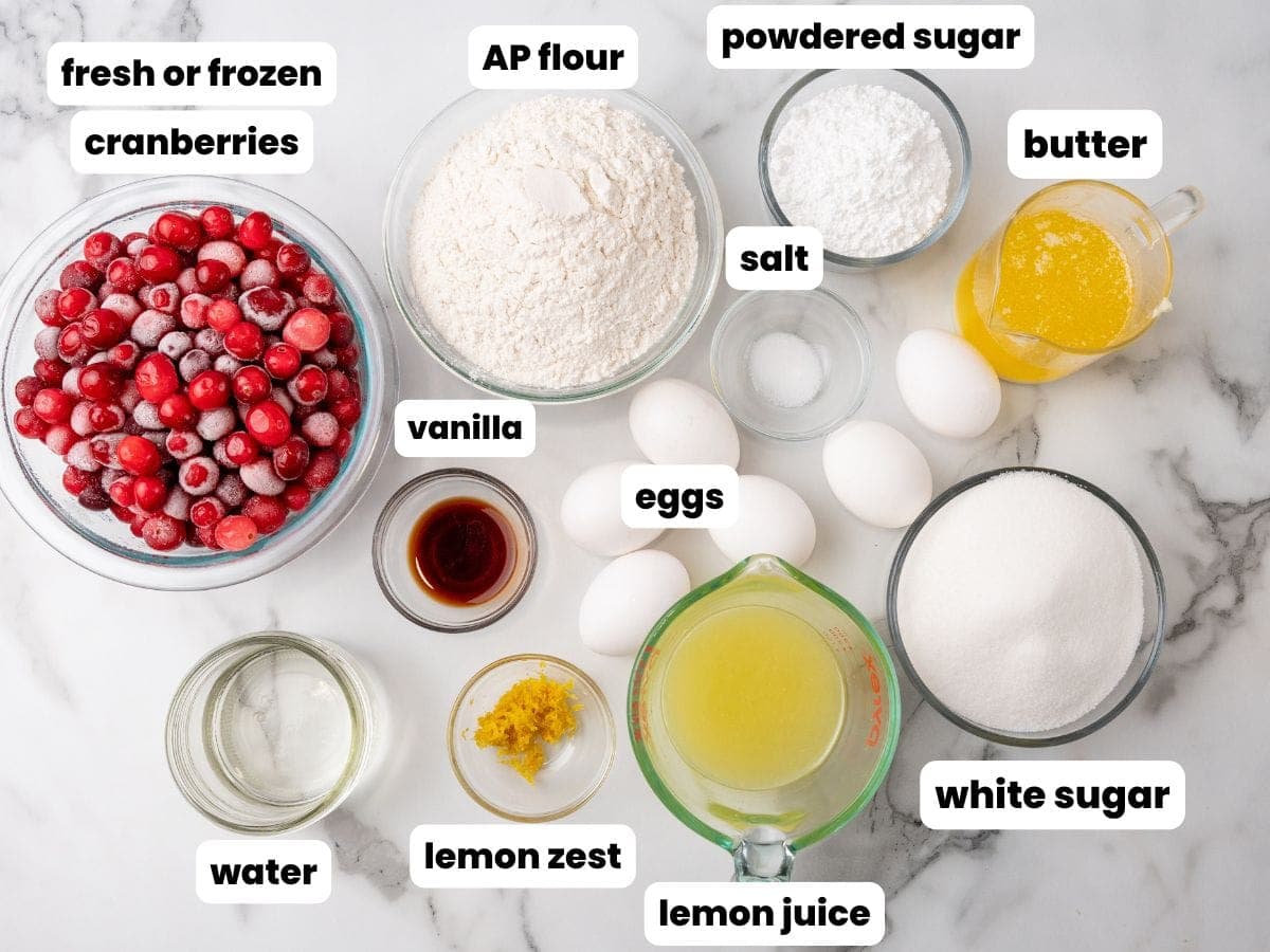 The ingredients needed to make cranberry lemon bars with fresh cranberries.