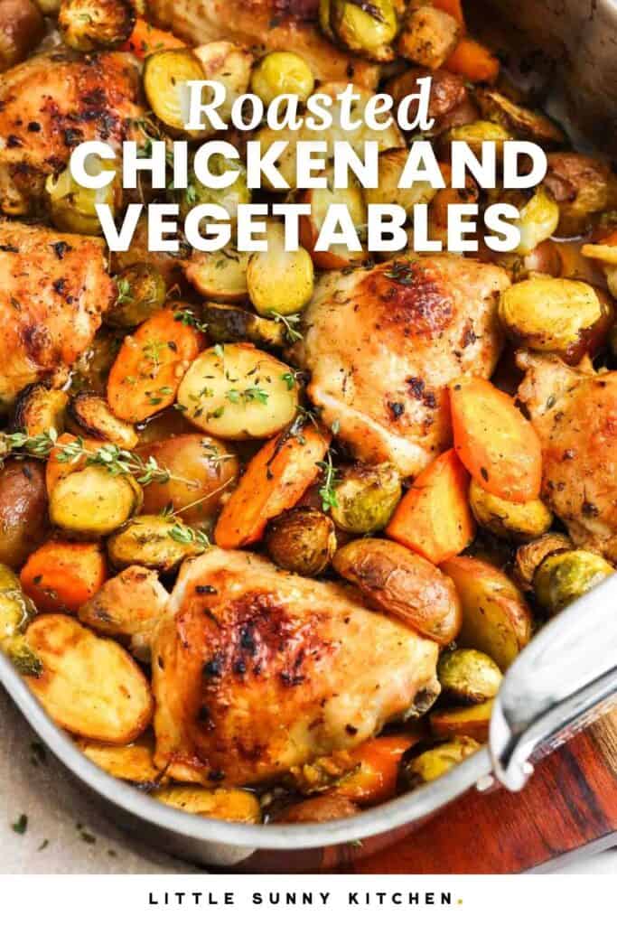 a large metal roasting pan of chicken thighs and roasted veggies. Text overlay says "roasted chicken and vegetables"