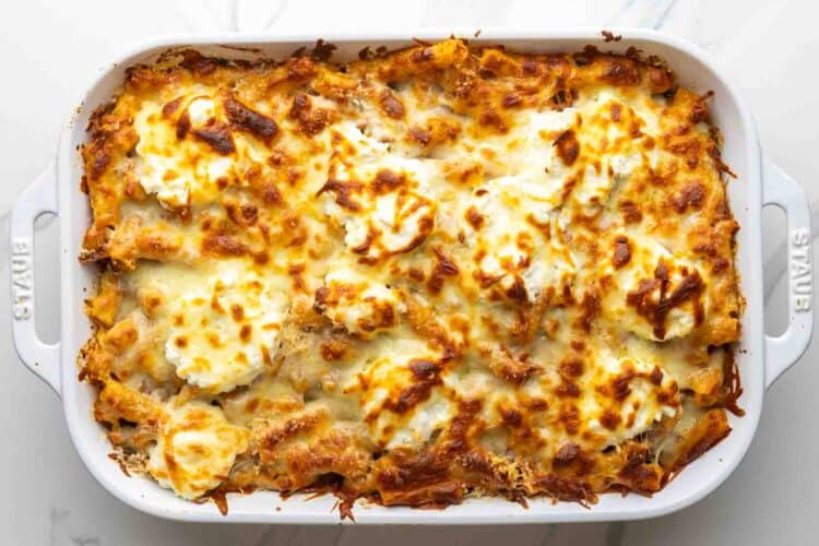 baked ziti with golden browned cheesy top after baking without the cover.